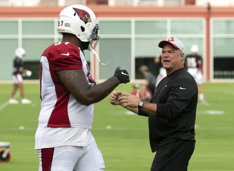 Cardinals linebackers coach Bill Davis talks with Cardinals defensive end Jordan Phillips during a practice at the Cardinals training facility in Tempe on August 31, 2021.

Cardinals Practice