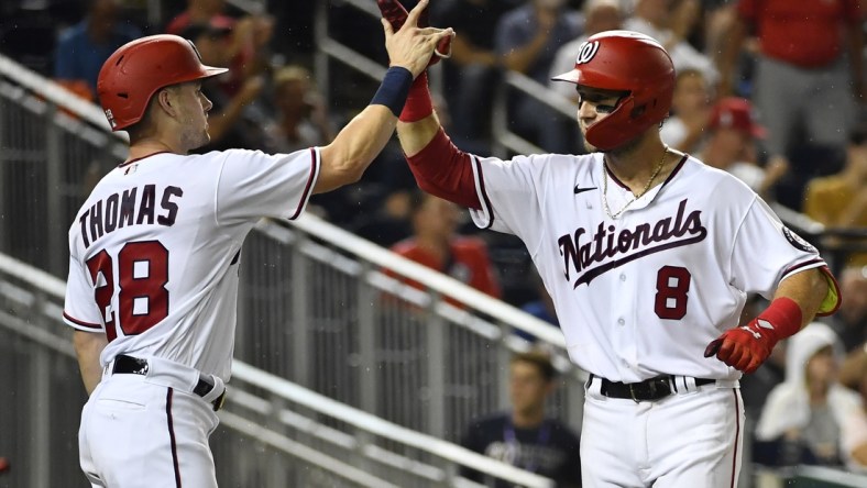 Aug 31, 2021; Washington, District of Columbia, USA; Washington Nationals third baseman Carter Kieboom (8) celebrates with center fielder Lane Thomas (28) after hitting a two run home run against the Philadelphia Phillies during the fourth inning at Nationals Park. Mandatory Credit: Brad Mills-USA TODAY Sports