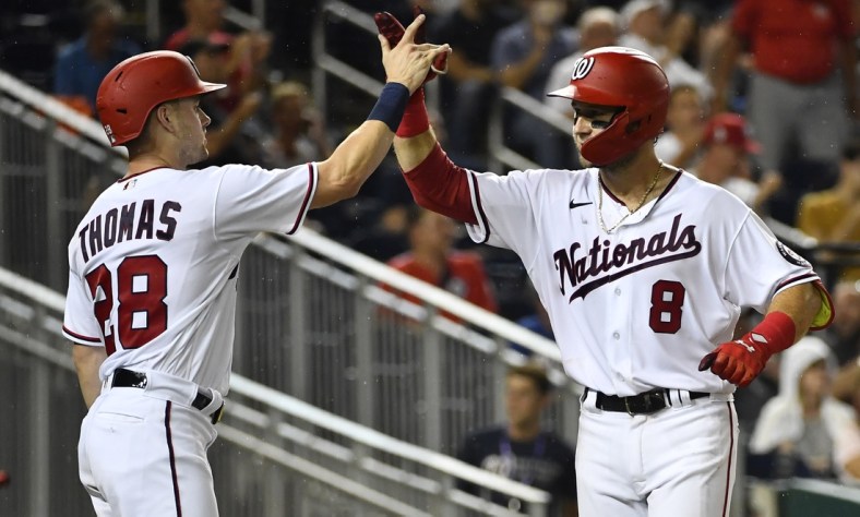 Aug 31, 2021; Washington, District of Columbia, USA; Washington Nationals third baseman Carter Kieboom (8) celebrates with center fielder Lane Thomas (28) after hitting a two run home run against the Philadelphia Phillies during the fourth inning at Nationals Park. Mandatory Credit: Brad Mills-USA TODAY Sports
