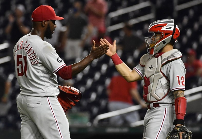 Aug 31, 2021; Washington, District of Columbia, USA; Philadelphia Phillies relief pitcher Enyel De Los Santos (51) is congratulated by catcher Rafael Marchan (12) after recording the final out against the Washington Nationals at Nationals Park. Mandatory Credit: Brad Mills-USA TODAY Sports
