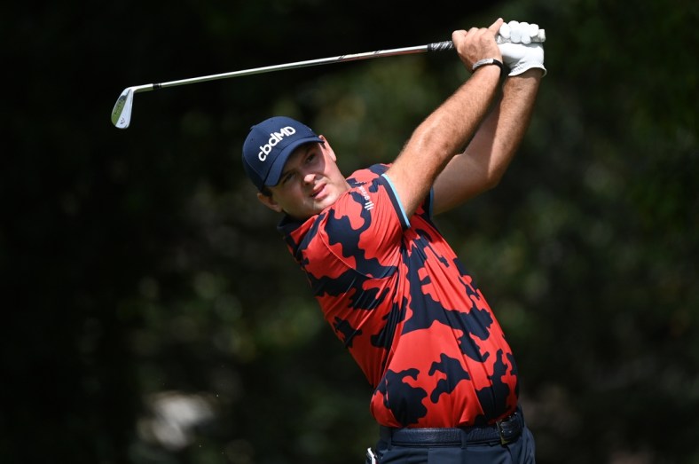 Sep 2, 2021; Atlanta, Georgia, USA; Patrick Reed plays his shot from the second tee during the first round of the Tour Championship golf tournament. Mandatory Credit: Adam Hagy-USA TODAY Sports