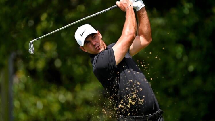 Sep 2, 2021; Atlanta, Georgia, USA; Brooks Koepka plays his shot from the second tee during the first round of the Tour Championship golf tournament. Mandatory Credit: Adam Hagy-USA TODAY Sports