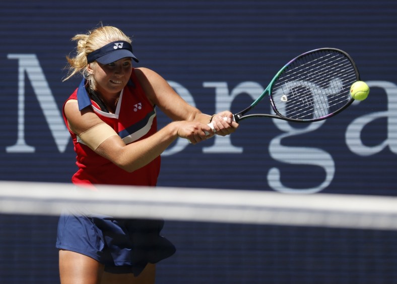 Sep 2, 2021; Flushing, NY, USA; Clara Tauson of Denmark hits a shot against Ashleigh Barty of Australia in a second round match on day four of the 2021 U.S. Open tennis tournament at USTA Billie Jean King National Tennis Center. Mandatory Credit: Jerry Lai-USA TODAY Sports