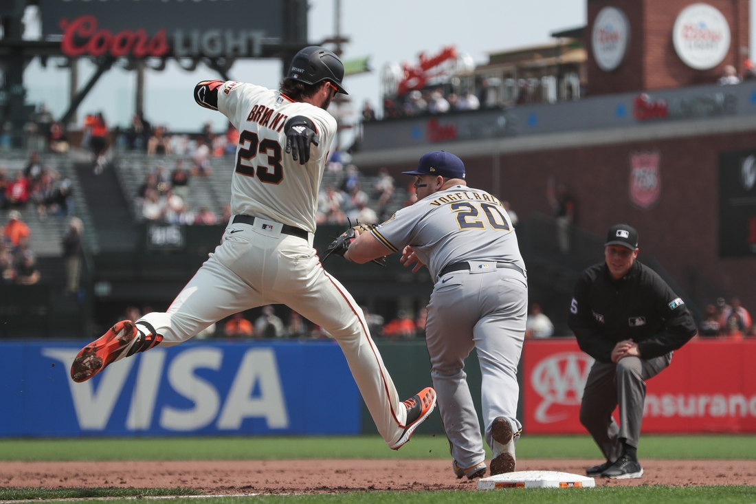 Sep 2, 2021; San Francisco, California, USA;  San Francisco Giants third baseman Kris Bryant (23) hits a single during the third inning against the Milwaukee Brewers at Oracle Park. Mandatory Credit: Sergio Estrada-USA TODAY Sports