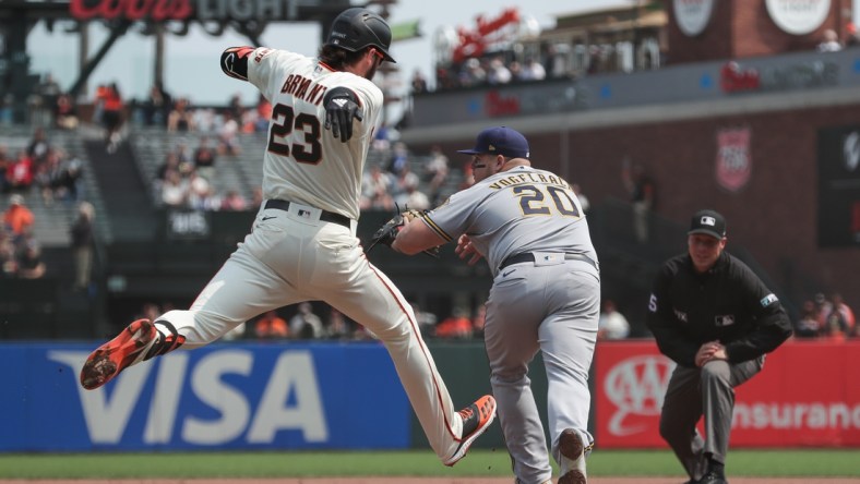 Sep 2, 2021; San Francisco, California, USA;  San Francisco Giants third baseman Kris Bryant (23) hits a single during the third inning against the Milwaukee Brewers at Oracle Park. Mandatory Credit: Sergio Estrada-USA TODAY Sports