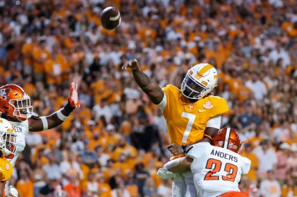 Sep 2, 2021; Knoxville, Tennessee, USA; Tennessee Volunteers quarterback Joe Milton III (7) throws the ball against Bowling Green Falcons linebacker Darren Anders (23) during the first quarter at Neyland Stadium. Mandatory Credit: Randy Sartin-USA TODAY Sports