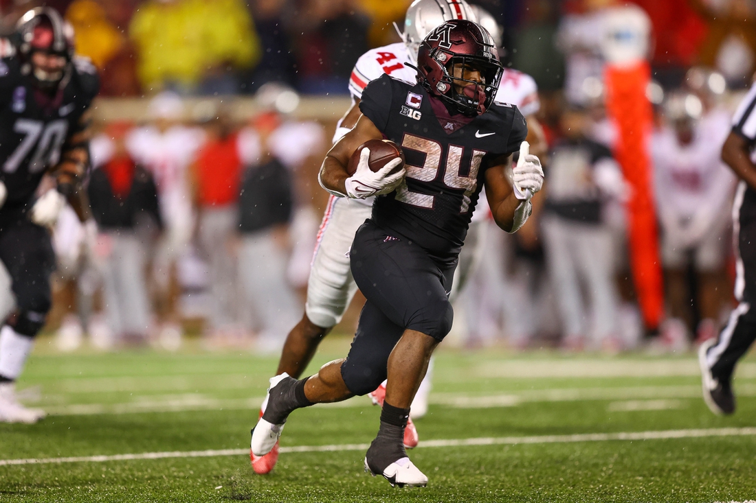 Sep 2, 2021; Minneapolis, Minnesota, USA; Minnesota Gophers running back Mohamed Ibrahim (24) runs the ball in for a touchdown during the third quarter against the Ohio State Buckeyes at Huntington Bank Stadium. Mandatory Credit: Harrison Barden-USA TODAY Sports