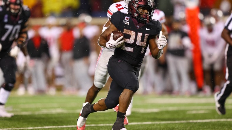 Sep 2, 2021; Minneapolis, Minnesota, USA; Minnesota Gophers running back Mohamed Ibrahim (24) runs the ball in for a touchdown during the third quarter against the Ohio State Buckeyes at Huntington Bank Stadium. Mandatory Credit: Harrison Barden-USA TODAY Sports