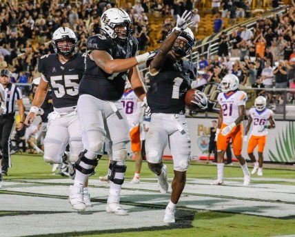 Sep 3, 2021; Orlando, Florida, USA; UCF Knights wide receiver Jaylon Robinson (1) celebrates with offensive lineman Samuel Jackson (73) after scoring a touchdown against the Boise State Broncos during the second half at Bounce House. Mandatory Credit: Mike Watters-USA TODAY Sports
