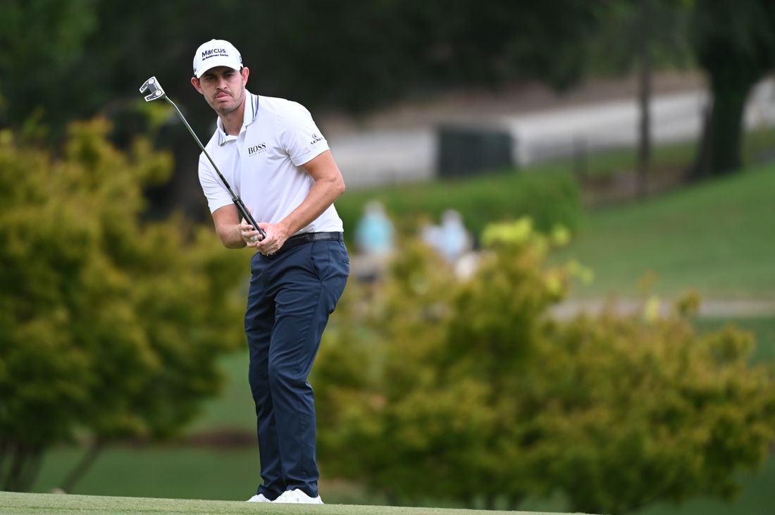 Sep 3, 2021; Atlanta, Georgia, USA; Patrick Cantlay watches his putt on 9th green during the second round of the Tour Championship golf tournament. Mandatory Credit: Adam Hagy-USA TODAY Sports