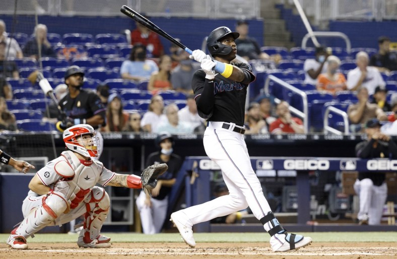 Sep 3, 2021; Miami, Florida, USA; Miami Marlins right fielder Jesus Sanchez (76) hits a three run home run against the Philadelphia Phillies during the first inning at loanDepot Park. Mandatory Credit: Rhona Wise-USA TODAY Sports