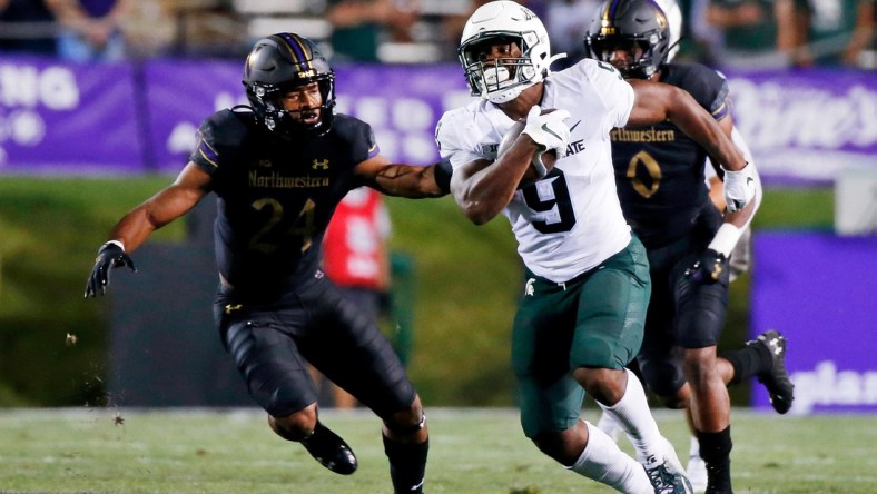 Sep 3, 2021; Evanston, Illinois, USA; Michigan State Spartans running back Kenneth Walker III (9) runs the ball against the Northwestern Wildcats during the second quarter at Ryan Field. Mandatory Credit: Jon Durr-USA TODAY Sports