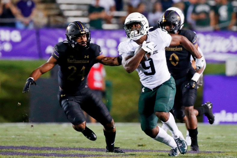 Sep 3, 2021; Evanston, Illinois, USA; Michigan State Spartans running back Kenneth Walker III (9) runs the ball against the Northwestern Wildcats during the second quarter at Ryan Field. Mandatory Credit: Jon Durr-USA TODAY Sports