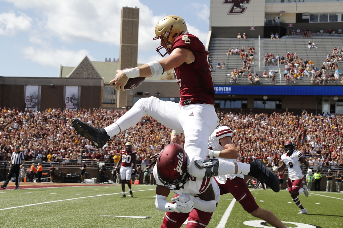 Sep 4, 2021; Chestnut Hill, Massachusetts, USA; Boston College Eagles tight end Trae Barry (3) hurdles Colgate Raiders defensive back Keshaun Dancy (20) for a touchdown during the first half at Alumni Stadium. Mandatory Credit: Winslow Townson-USA TODAY Sports