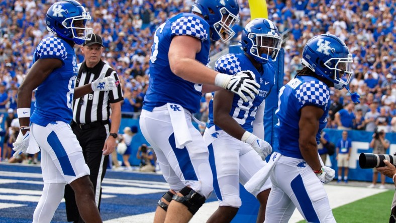 Sep 4, 2021; Lexington, Kentucky, USA; The Kentucky Wildcats offense celebrates a touchdown scored by wide receiver Wan'Dale Robinson (1) during the second quarter against the Louisiana-Monroe Warhawks at Kroger Field. Mandatory Credit: Jordan Prather-USA TODAY Sports