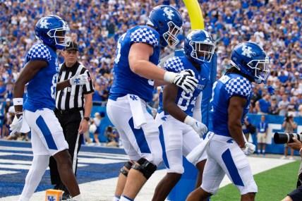 Sep 4, 2021; Lexington, Kentucky, USA; The Kentucky Wildcats offense celebrates a touchdown scored by wide receiver Wan'Dale Robinson (1) during the second quarter against the Louisiana-Monroe Warhawks at Kroger Field. Mandatory Credit: Jordan Prather-USA TODAY Sports