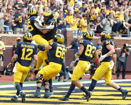 Michigan running back Blake Corum celebrates with teammates after his touchdown against Western Michigan during the first half in Ann Arbor on Saturday, Sept. 4, 2021.

Mich West