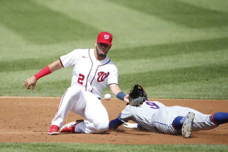 Sep 4, 2021; Washington, District of Columbia, USA; New York Mets center fielder Brandon Nimmo (9) steals second base ahead of a tag by Washington Nationals second baseman Luis Garcia (2) in the second inning at Nationals Park. Mandatory Credit: Amber Searls-USA TODAY Sports