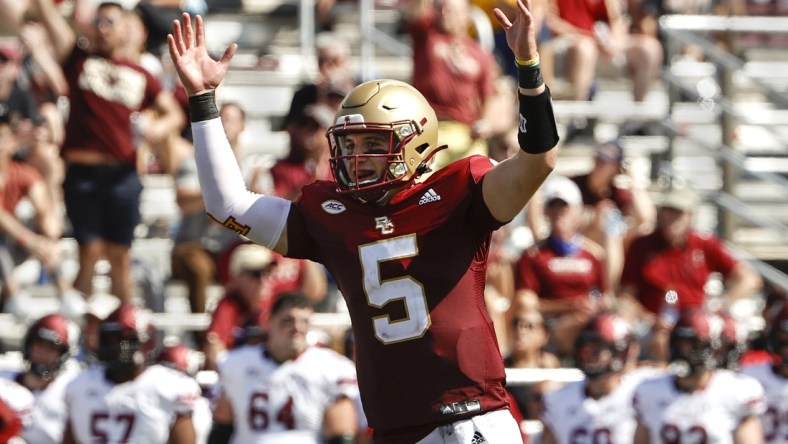 Sep 4, 2021; Chestnut Hill, Massachusetts, USA; Boston College Eagles quarterback Phil Jurkovec (5) celebrates a touchdown against the Colgate Raiders during the second half at Alumni Stadium. Mandatory Credit: Winslow Townson-USA TODAY Sports