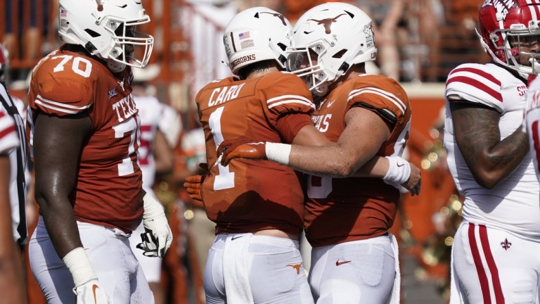 Sep 4, 2021; Austin, Texas, USA; Texas Longhorns tight end Cade Brewer (80) hugs quarterback Hudson Card (1) after catching a touchdown pass in the first half of the game against the Louisiana Ragin' Cajuns at Darrell K Royal-Texas Memorial Stadium. Mandatory Credit: Scott Wachter-USA TODAY Sports