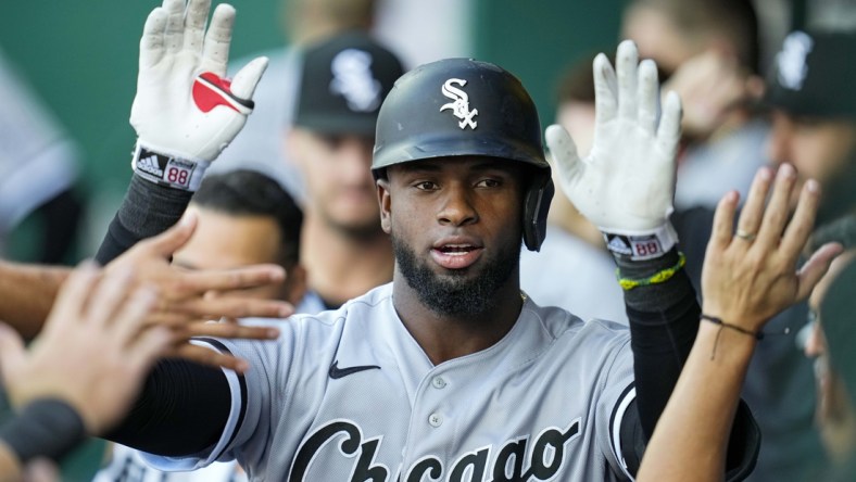 Sep 4, 2021; Kansas City, Missouri, USA; Chicago White Sox center fielder Luis Robert (88) is congratulated after hitting a home run against the Kansas City Royals during the first inning at Kauffman Stadium. Mandatory Credit: Jay Biggerstaff-USA TODAY Sports