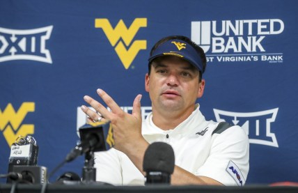 Sep 4, 2021; College Park, Maryland, USA; West Virginia Mountaineers head coach Neal Brown talks to the media after a loss to the Maryland Terrapins at Capital One Field at Maryland Stadium. Mandatory Credit: Ben Queen-USA TODAY Sports