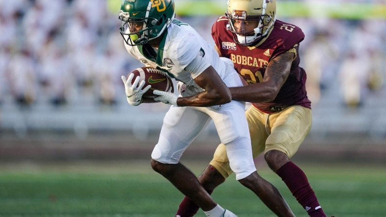 Sep 4, 2021; San Marcos, Texas, USA;  Baylor Bears wide receiver Tyquan Thornton (9) runs the ball against Texas State Bobcats cornerback Michael LoVett III (21) in the second quarter at Bobcat Stadium. Mandatory Credit: Daniel Dunn-USA TODAY Sports