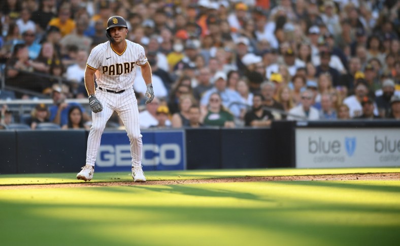 Sep 4, 2021; San Diego, California, USA; San Diego Padres second baseman Adam Frazier (12) leads off third base during the second inning against the Houston Astros at Petco Park. Mandatory Credit: Orlando Ramirez-USA TODAY Sports