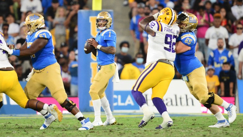 Sep 4, 2021; Pasadena, California, USA; UCLA Bruins quarterback Dorian Thompson-Robinson (1) drops back to pass against the Louisiana State Tigers during the first half the at the Rose Bowl. Mandatory Credit: Gary A. Vasquez-USA TODAY Sports