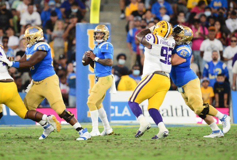 Sep 4, 2021; Pasadena, California, USA; UCLA Bruins quarterback Dorian Thompson-Robinson (1) drops back to pass against the Louisiana State Tigers during the first half the at the Rose Bowl. Mandatory Credit: Gary A. Vasquez-USA TODAY Sports
