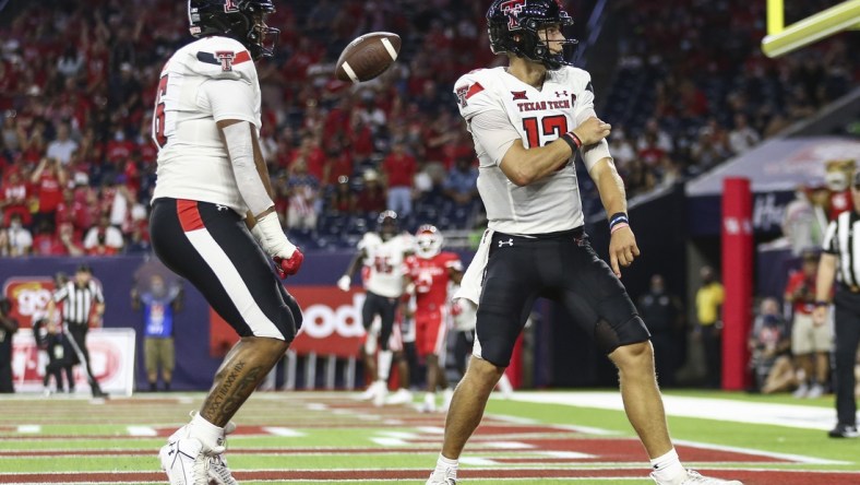 Sep 4, 2021; Houston, Texas, USA; Texas Tech Red Raiders quarterback Tyler Shough (12) reacts after rushing for a touchdown during the third quarter against the Houston Cougars at NRG Stadium. Mandatory Credit: Troy Taormina-USA TODAY Sports