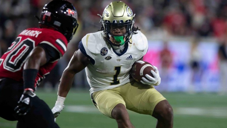 Sep 4, 2021; Atlanta, Georgia, USA; Georgia Tech Yellow Jackets running back Jahmyr Gibbs (1) runs the ball against Northern Illinois Huskies cornerback Zhamaine March (20) during the second half at Bobby Dodd Stadium. Mandatory Credit: Jenn Finch-USA TODAY Sports