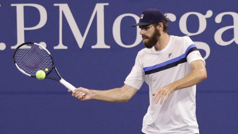 Sep 4, 2021; Flushing, NY, USA; Reilly Opelka of the United States hits a forehand against Nikoloz Basilashvili of Georgia (not pictured) on day six of the 2021 U.S. Open tennis tournament at USTA Billie Jean King National Tennis Center. Mandatory Credit: Geoff Burke-USA TODAY Sports