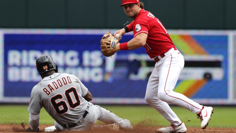 Sep 5, 2021; Cincinnati, Ohio, USA; Detroit Tigers center fielder Akil Baddoo (60) is forced out at second base against Cincinnati Reds shortstop Kyle Farmer (17) during the third inning at Great American Ball Park. Mandatory Credit: David Kohl-USA TODAY Sports