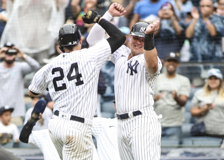 Sep 5, 2021; Bronx, New York, USA;  New York Yankees catcher Gary Sanchez (24) is greeted by designated hitter Luke Voit (59) after hitting a grand slam home run in the second inning against the Baltimore Orioles at Yankee Stadium. Mandatory Credit: Wendell Cruz-USA TODAY Sports
