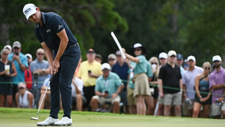 Sep 5, 2021; Atlanta, Georgia, USA; Patrick Cantlay putts on the 7th hole during the final round of the Tour Championship golf tournament. Mandatory Credit: Adam Hagy-USA TODAY Sports