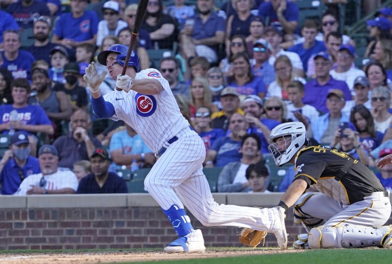 Sep 5, 2021; Chicago, Illinois, USA; Chicago Cubs first baseman Frank Schwindel (18) hits a grand slam home run against the Pittsburgh Pirates during the seventh inning at Wrigley Field. Mandatory Credit: David Banks-USA TODAY Sports
