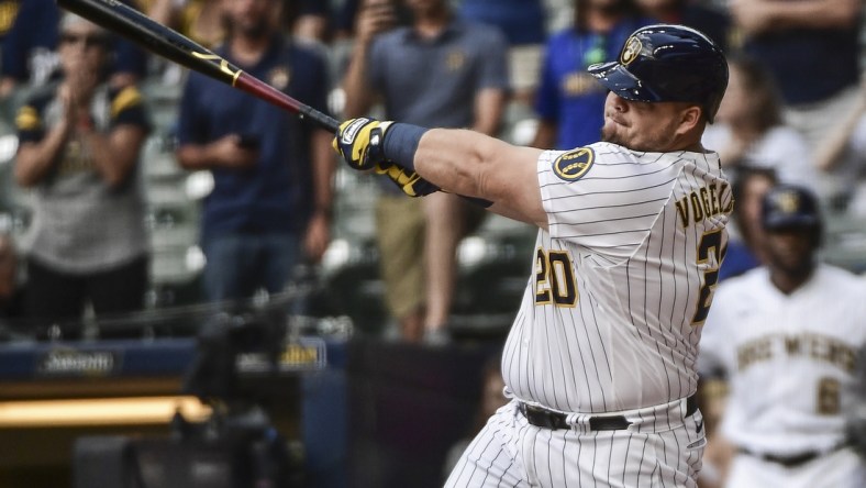 Sep 5, 2021; Milwaukee, Wisconsin, USA;  Milwaukee Brewers first baseman Daniel Vogelbach (20) hits a grand slam home run in the ninth inning to beat the St. Louis Cardinals at American Family Field. Mandatory Credit: Benny Sieu-USA TODAY Sports