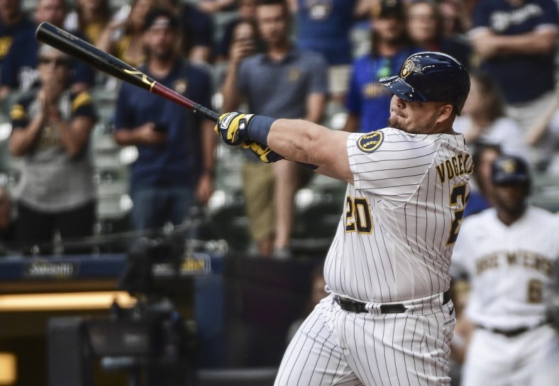 Sep 5, 2021; Milwaukee, Wisconsin, USA;  Milwaukee Brewers first baseman Daniel Vogelbach (20) hits a grand slam home run in the ninth inning to beat the St. Louis Cardinals at American Family Field. Mandatory Credit: Benny Sieu-USA TODAY Sports