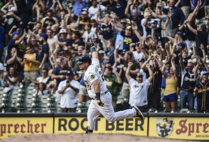 Sep 5, 2021; Milwaukee, Wisconsin, USA;  Milwaukee Brewers first baseman Daniel Vogelbach (20) reacts after hitting a grand slam home run in the ninth inning to beat the St. Louis Cardinals at American Family Field. Mandatory Credit: Benny Sieu-USA TODAY Sports