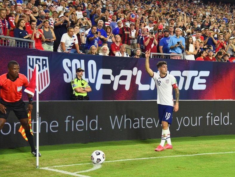 Sep 5, 2021; Nashville, Tennessee, USA; United States midfielder Christian Pulisic (10) on a corner kick in the first half against Canada during a CONCACAF FIFA World Cup Qualifier soccer match at Nissan Stadium. Mandatory Credit: Christopher Hanewinckel-USA TODAY Sports