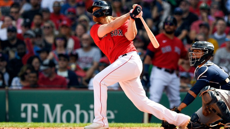 Sep 6, 2021; Boston, Massachusetts, USA; Boston Red Sox shortstop Taylor Motter (30) watches the ball after hitting an RBI double against the Tampa Bay Rays during the second inning at Fenway Park. Mandatory Credit: Brian Fluharty-USA TODAY Sports