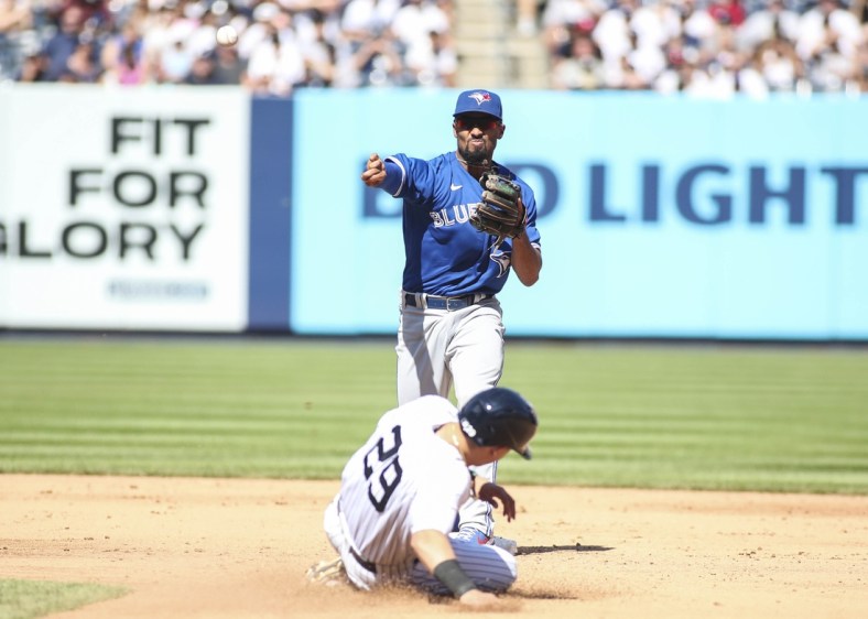 Sep 6, 2021; Bronx, New York, USA;  Toronto Blue Jays second baseman Marcus Semien (10) throws to first to complete a double play in the sixth inning against the New York Yankees at Yankee Stadium. Mandatory Credit: Wendell Cruz-USA TODAY Sports