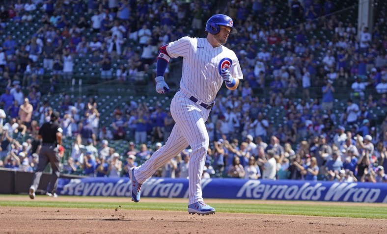 Sep 6, 2021; Chicago, Illinois, USA; Chicago Cubs left fielder Ian Happ (8) runs the bases after hitting a three run home run against the Cincinnati Reds during the first inning at Wrigley Field. Mandatory Credit: David Banks-USA TODAY Sports