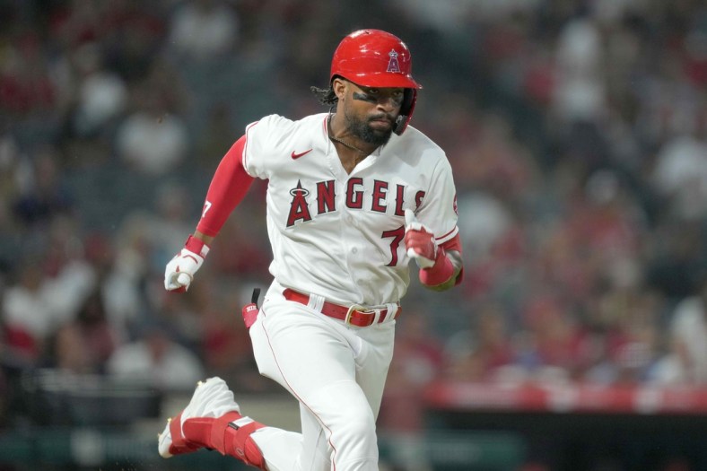 Sep 6, 2021; Anaheim, California, USA; Los Angeles Angels left fielder Jo Adell (7) runs to first base after hitting a single against the Texas Rangers in the seventh inning at Angel Stadium. Mandatory Credit: Kirby Lee-USA TODAY Sports