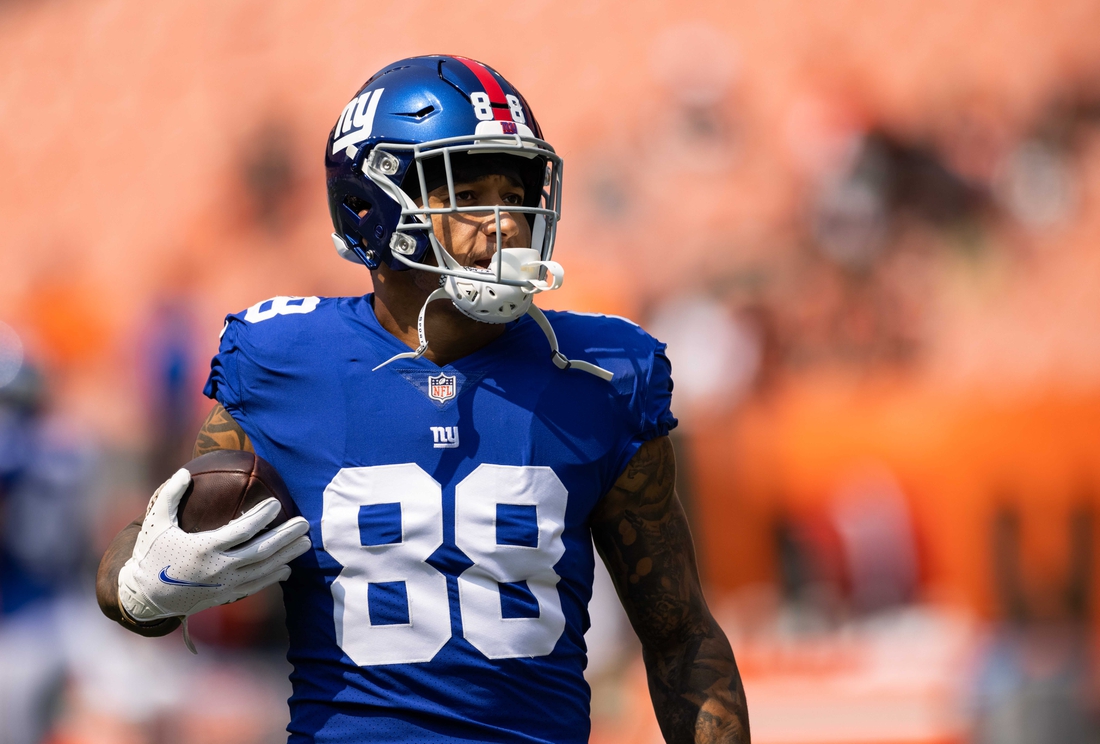 Aug 22, 2021; Cleveland, Ohio, USA; New York Giants tight end Evan Engram (88) runs the ball during warmups before the game against the Cleveland Browns at FirstEnergy Stadium. Mandatory Credit: Scott Galvin-USA TODAY Sports