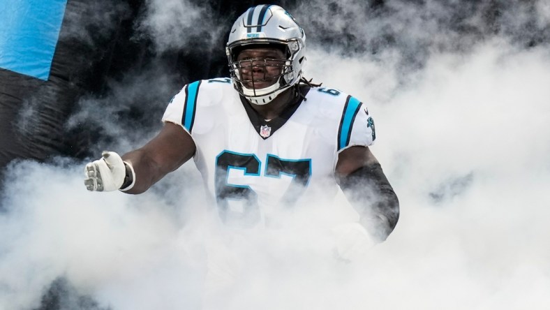 Aug 27, 2021; Charlotte, North Carolina, USA; Carolina Panthers offensive guard John Miller (67) runs onto the field during the first quarter against the Pittsburgh Steelers at Bank of America Stadium. Mandatory Credit: Jim Dedmon-USA TODAY Sports