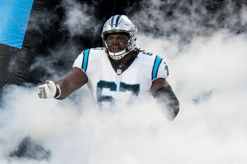 Aug 27, 2021; Charlotte, North Carolina, USA; Carolina Panthers offensive guard John Miller (67) runs onto the field during the first quarter against the Pittsburgh Steelers at Bank of America Stadium. Mandatory Credit: Jim Dedmon-USA TODAY Sports