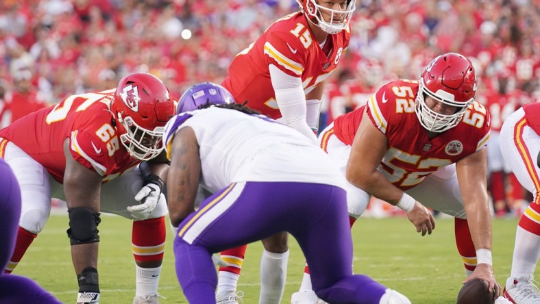 Aug 27, 2021; Kansas City, Missouri, USA; Kansas City Chiefs quarterback Patrick Mahomes (15) goes under center Creed Humphrey (52) against the Minnesota Vikings during the game at GEHA Field at Arrowhead Stadium. Mandatory Credit: Denny Medley-USA TODAY Sports