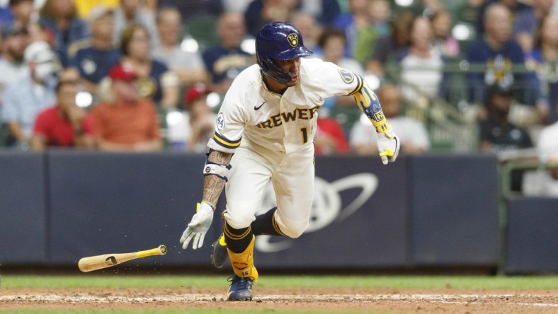 Sep 7, 2021; Milwaukee, Wisconsin, USA;  Milwaukee Brewers second baseman Kolten Wong (16) hits a two run single during the sixth inning against the Philadelphia Phillies at American Family Field. Mandatory Credit: Jeff Hanisch-USA TODAY Sports